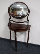 A mahogany D shaped table,