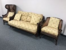 A contemporary bamboo style three piece lounge suite comprising of wing armchair, tub chair,