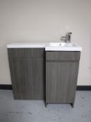 A corner sink with cabinet and tap