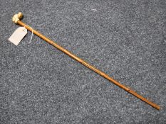 A carved bone miniature dogs head walking stick,