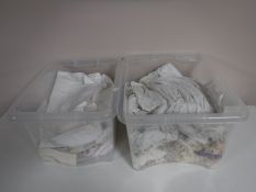 Two boxes of antique christening gowns and table linen