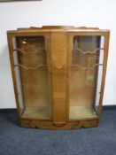 A walnut double door display cabinet