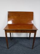 A Victorian mahogany turnover top tea table
