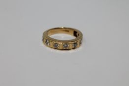 18ct half eternity ring with eight stones 5.