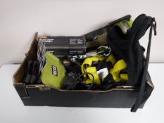 A box containing power tools, tire inflator, hand saw, harness strap, rucksack,
