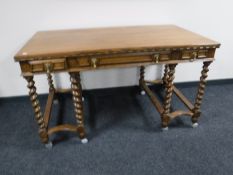 A William and Mary style oak writing table on barley twist legs