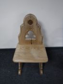 An early 20th century pine church chair