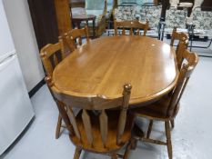 An oval rubber wood kitchen table,