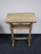 An early 20th century pine prayer book stand