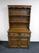 A carved oak kitchen dresser