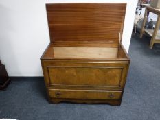A walnut blanket box fitted with a drawer