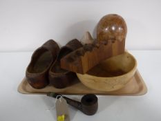 A tray containing wooden pieces and treen including fruitbowl, pipe and pipe rack, vase,