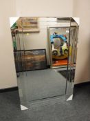 A contemporary all glass mirror