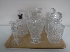 A tray of 20th century glass ware including four decanters with stoppers (including one with silver