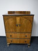 A mid twentieth century walnut linen chest