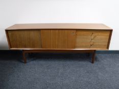 A mid 20th century teak low sideboard CONDITION REPORT: Drawer fronts faded