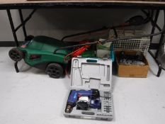 A Qualcast electric lawnmower, together with two boxes containing hand drills,