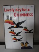 An advertising painting on panel - Lovely day for a Guinness