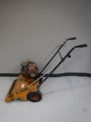 A Sisis Trio Rotorake petrol rotovator with roller