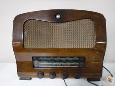 A 20th century walnut cased Defiant valve radio