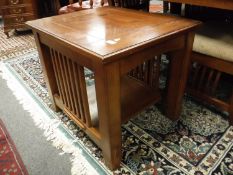 A contemporary arts and crafts style oak two tier occasional table,
