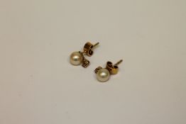 A pair of 14ct gold pearl and diamond earrings