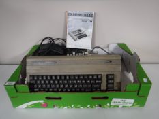 A boxed Commodore 64 with games