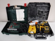 A cased Bosch electric jigsaw,