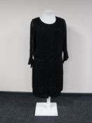 A 1920's hand beaded flapper dress on vintage mannequin