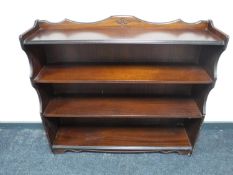 A set of mahogany effect open bookshelves