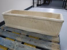 A composition garden trough