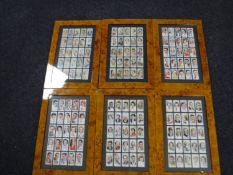Six frames containing Players cigarette cards,
