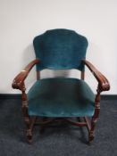 An armchair upholstered in a turquoise dralon