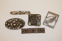 Five silver brooches