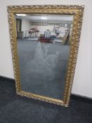 A gilt framed etched mirror depicting a falconer on horse back