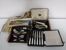 A tray containing sterling silver sugar sifter,