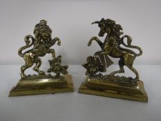 A pair of early twentieth century brass bookends,