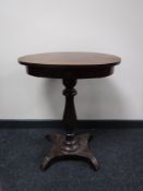 An early 20th century mahogany pedestal occasional table fitted a drawer