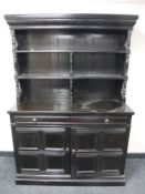 An antique stained oak dresser