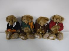 A set of four Dean jointed mohair teddy bears with musical instruments