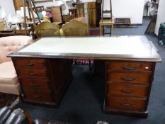 A late Victorian mahogany twin pedestal writing desk