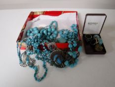 A box containing turquoise costume jewellery