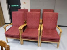 A set of six beech framed high backed armchairs