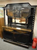 A late nineteenth century oak sideboard with barleytwist supports,
