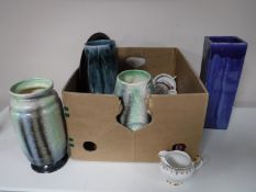 A box and a tray of assorted china including Bing & Grondall dishes, two Portmeirion oven dishes,