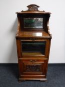 An Edwardian mahogany cabinet fitted with a mag rack