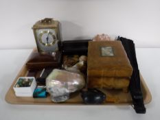 A tray containing leather jewellery box, hand fan, shells, lighters, marble mantel clock,