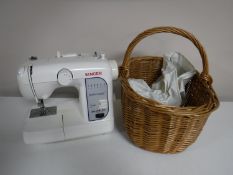 A Singer featherweight electric sewing machine,