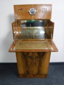 A mid 20th century walnut cocktail cabinet