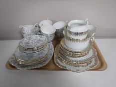 A tray containing two Windsor bone china tea sets